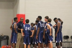 submitted photo Charles Henderson Middle School players huddle around head coach Shelby Tuck during a timeout.