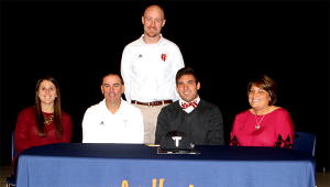 Chase Smartt, second from right, signed a baseball scholarship to play on the same field as his father Mark Smartt, While Smartt is currently the assistant coach for the Troy Trojans, he will be named head coach following the 2015 season and will have the opportunity to coach his son. MESSENGER PHOTO/DAN SMITH