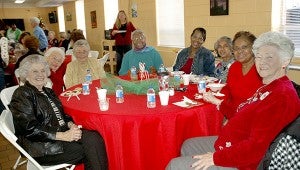 The Colley Senior Complex “family” celebrated Christmas with a shared breakfast Wednesday. They enjoyed special music by Shelia Jackson and Homer Wright and the fellowship of being together with friends. Pictured, from left, is one table of friends, Jane Hamrick, Jane Kennedy, Ruby Ryals, Sallie Fenn, Debra Darby, Mary Brundidge, Betty Sue Jones and Betty Minton.   MESSENGER PHOTO/JAINE TREADWELL