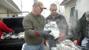 Volunteers help cook the turkeys for more than 150 people in need who will receive a full Christmas dinner thanks to Turkeys from Heaven. Kelly Sanders, organizer of Pike County’s Turkeys from Heaven, was thrilled with the amount of community support shown for the Turkeys from Heaven project and hopes to continue this Christmas tradition for years to come in Pike County.  MESSENGER PHOTO/JAINE TREADWELL