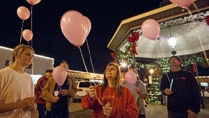Above, Bindi Post, center, joins others in releasing balloons with messages during a candlelight vigil in memory of Zoe Post. Family, friends and community members gathered to honor the memory of Post on her birthday. Post died two years ago. David Post, Zoe’s father, said they were ‘remembering her life’ and raising awareness of the effects of bullying. MESSENGER PHOTO/THOMAS GRANING