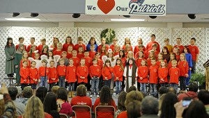 Second and third grade students at Pike Liberal Arts School perform during the school's Christmas program, A King is Born, at the school Thursday. MESSENGER PHOTO/THOMAS GRANING