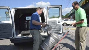 Kegs of beer were loaded and delivered to Troy bars and restaurants in late April, as the city allowed draft beer sales for the first time. MESSENGER FILE PHOTO