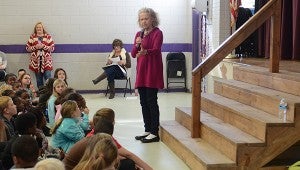 Barbara McBride-Smith uses hand gestures and funny voices to further her stories. Friday morning, McBride-Smith held the attention of 300 Goshen Elementary students with an elaborate scary story and anecdote about sharing and giving back.  MESSENGER PHOTO/SCOTTIE BROWN