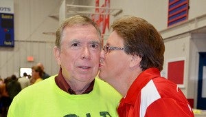 Pike Liberal Arts School Headmaster Becky Baggett kisses her husband Ken during an assembly in the school’s gym. Baggett made a promise to SGA students that she would kiss a goat if students were able to collect enough food items for Salem Troy Baptist Association.  MESSENGER PHOTO/COURTNEY PATTERSON
