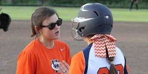 CHHS head coach Heather Mitchell goes over an at-bat strategy with Tucker Earles. MESSENGER PHOTO/DAN SMITH
