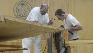 Workers from the Alabama Correctional Industries remodeling the courtroom at the Pike County Courthouse.