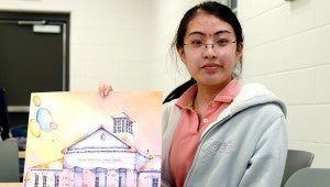 Messenger Photo/Ngoc Vo Demi Huynh, an eighth-grader from Charles Henderson Middle School in her art class. Huynh recently has been recognized by Troy City Schools for her watercolor painting titled “My School.”
