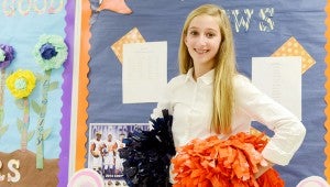 Hannah Huner shows off her pom poms to show her excitement to be returning to the CHMS cheerleading squad.