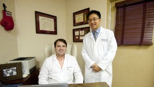 From left, Dr. Chuck Wood, M.D. and Dr. Baoquang Le, D.O. at Troy Regional Medical Center. Dr. Le has recently joined the medical staff and the practice of Dr. Wood.
