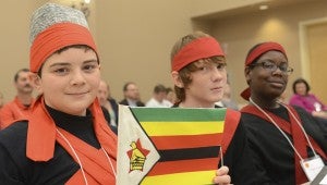 From left, Russell Clark, Jacob Loff and Tobias Thomas from Ozark City Schools representing Zimbabwe in the Southeast Alabama Model United Nations Assembly on Thursday. 