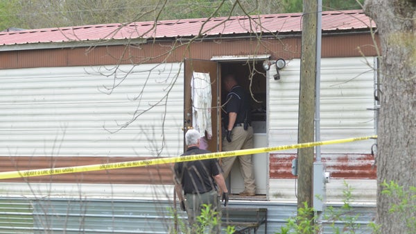 Investigators with the PIke County Sheriff's Department worked the scene of a domestic dispute that turned deadly in Goshen early Friday.