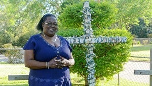 Messenger photo/Courtney Patterson Myrtle Tolbert displays the true Easter story in lights in her front yard. She created the cross with blood flowing from it.
