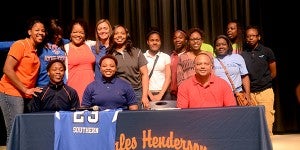Tajianah Brundidge, center, signed a scholarship with Alabama Southern Community College out of Monroeville Friday morning at Charles Henderson High School. MESSENGER PHOTO/SCOTTIE BROWN