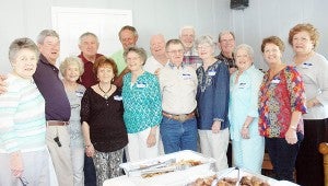 Schoolmates from the Pike County High School years 1959-62 gathered for a mega lunch at Lake Simmie yesterday. Pictured from left are Mattie Murphy, Donny Mobley, Mary Taylor, Polly Graham, Rayvon Graham, Nellie Sue Helms, Steve Carter, Sanford Hussey, Fred Copeland, Les Jackson, Sue Dunn, Roy Medley, Judy Harden, Clara Culpepper and Grace Senn. Above, Wilburn Senn enjoys a good laugh with Billy Jinright and Patsy Taylor Jinright.