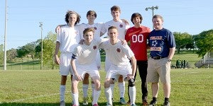 The Charles Henderson boys soccer team  celebrated their six senior Tuesday before their match against Jefferson Davis High Schools. Left to right, back row: Ryley Williamson, Rhett Outlaw, Ben Salmon, Connor Adley and assistant coach Will Bailey. Left to right, front row: Will Young and Taylor Montgomery.  MESSENGER PHOTO/SCOTTIE BROWN