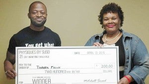 Messenger Photo/Jaine Treadwell Tawanda Fayson of Troy was the winner in the 21 Day New Me Challenge. Mitch Sneed, Physiques by Suso, presented the winner’s check to Fayson on Monday.