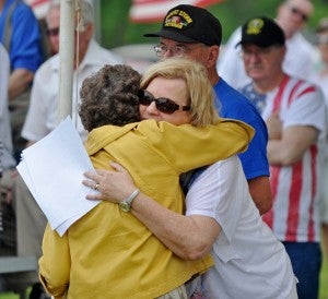 Helion Motes hugs Bonnie Brown, the mother of the most recent Pike County resident to die in service.