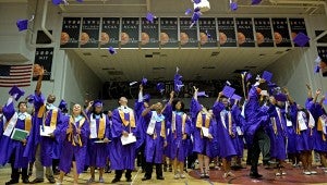 The Pike County High Class of 2015 toss their caps after receiving their diplomas Friday in Sartain Hall at Troy University.  MESSENGER PHOTO/THOMAS GRANING