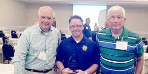 Chuck Ash, left, Dave Bush, center, and Doc Anderson, right, were present at the Alabama Athletic Trainers Association annual conference Saturday. Bush was named Athletic Trainer of the Year. Bush serves as an athletic trainer for several schools. SUBMITTED PHOTO
