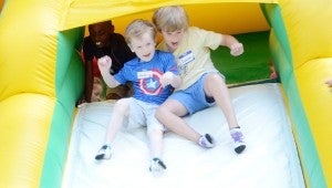 Messenger photo/Courtney Patterson St. Mark’s Episcopal Church had their first day of Vacation Bible School Wednesday.  Jonah Brown and Camden Moseley slide down an inflatable slide outside of the church during their recreation time.