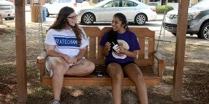 Messenger photo/Scottie Brown Lindsey Lee, left, a rising Charles Henderson senior, sits with Krishna Patel, right, who will attending Auburn in the fall. The two shared laughs, ice cream and enjoyed the good weather Monday afternoon.