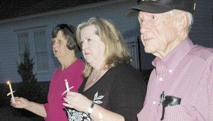 Messenger Photo/Jaine Treadwell  Col. (ret.) William L. Jackson, a veteran of WWII and Korea, participated in the candle lighting ceremony at the Salute to Veterans in Brundidge. Also pictured are Dixie Shehane, center, and Nell McLendon. The Salute to Veterans is an annual event of the Brundidge Business Association.