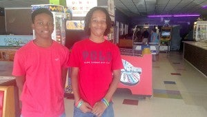 MESSENGER PHOTO/COURTNEY PATTERSON Amaghie Lampley, left, and Caleb Foster, right, celebrated the end of the GEAR UP summer enrichment program at the Party Pad in Troy with their fellow classmates.
