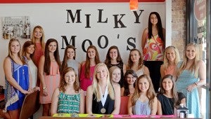 MESSENGER PHOTO/COURTNEY PATTERSON The Distinguished Young Women participants and little sisters held a fundraiser at Milky Moo’s in Downtown Troy Thursday. Forty percent of the ice cream sales went toward the scholarship funds for the program. Customers could also pay $1 to sign individual “good luck” posters, with all of that money going to the scholarship funds, as well. The DYW program is Saturday at 2 p.m. at the Claudia Crosby Theater at Troy University.