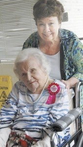 MESSENGER PHOTO/JAINE TREADWELL Velma Folmar Hightower, a Goshen native, celebrated her 103rd birthday Wednesday. Her daughter, Charlotte Goeters of Houston, Texas., other family members and friends hosted a part in her honor at the nursing home in Luverne.