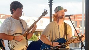 MESSENGER PHOTO/COURTNEY PATTERSON Troy University held Taste of Troy on The Square in Downtown Troy Friday night, bringing university students downtown to see what Troy has to offer. Students performed live to provide musical entertainment. 