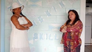MESSENGER PHOTO/COURTNEY PATTERSON Bootsy Taylor, left, and Elaine Corbin stand in The Smokin’ Skillet Cafe, which is undergoing final construction and maintenance. The cafe will offer home-style Carribbean foods and a family-oriented atmosphere and experience.