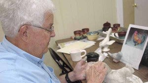 MESSENGER PHOTO/JAINE TREADWELL Marvin Dillard creates a clay chicken in the Pottery Studio at the Colley Complex.