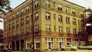 Picture is a postcard with a picture of the Hotel Troy. Cindy Hinton’s father owned and operated the hotel from 1957 until it closed in 1971.