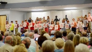 MESSENGER PHOTO/COURTNEY PATTERSON PLAS fourth graders created and recited an acronym for "Grandparents day."