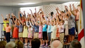 MESSENGER PHOTO/COURTNEY PATTERSON Messenger PHoto/courtney patterson The fourth grade class sings a song to their grandparents while dancing to the music.