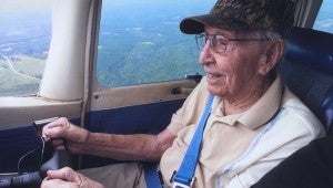 SUBMITTED PHOTO Obie Russell, 100 years old, flies an airplane one more time to empty his bucket list. Russell said going up in a plane again made his Top Ten list for his lifetime.