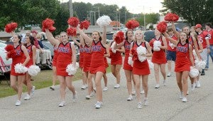MESSENGER PHOTO/COURTNEY PATTERSON Pike Liberal Arts School held its annual homecoming parade Thursday. PLAS cheerleaders lead the crows in cheers as they march in the parade.