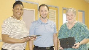 MESSENGER PHOTO/JAINE TREADWELL Pictured from left, Dr. LaKerri Mack, chair of the Boys and Girls Club board; Wayne Buchannan, Club director, and Cindy Hinton, OCAP services director. 