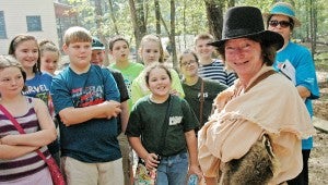 MESSENGER PHOTO/JAINE TREADWELL Much to the amusement of his young audience, Davy Crockett, a.k.a. Al Bouler flashed his grin that would stop a bear dead in its tracks.