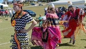 MESSENGER PHOTO/COURTNEY PATTERSON Troy University hosted the Ma-Chis Lower Creek Indian Tribe of Alabama Powwow Friday for a school day event. The Powwow will continue today. Above, women demonstrate a Native American Dance.