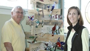 MESSENGER PHOTO/JAINE TREADWELL Something old and some new make a great combination. Charles Adams and his daughter-in-law, Melanie Adams, have combined their talents to create unusual showcases for items for sale at this weekend’s Adams Glass Studio Open House at the studio and Nut Shop on Highway 231 south of Troy. The public is invited. 