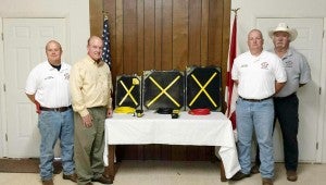 SUBMITTED PHOTO The Banks Volunteer Fire Department received a $5,000 grant from DuPoint Pioneer to be used for rescue equipment. Pictured, from left, are Jake DuBose, Banks assistant fire chief; Leonard Kuykendall, Pioneer DuPont representative; Shayne Brown, Banks fire chief, and Don Smith, Lieutenant.