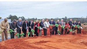 Representatives of the City of Troy, Harbert Realty Services, Publix Super Markets Inc. and the PIke County Economic Development Corp. took part in Monday’s groundbreaking ceremony for the new Park Place Commercial Development featuring Publix. Inset below, Publix Regional Director David Currey and Troy Mayor Jason Reeves were among those who spoke to the crowd during the event.