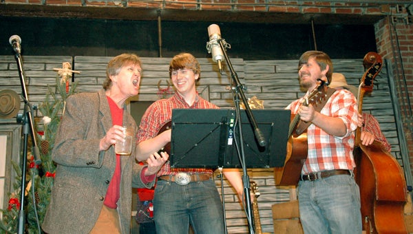 Andy Irwin performs with the Benton Brothers during the Chili Country Christmas storytelling event at the We Piddle Around Theatre.