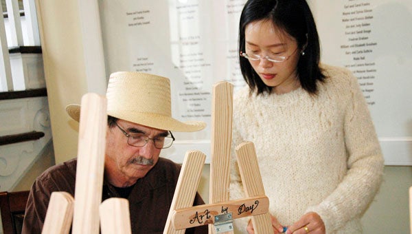 When it comes to art, Larry Aldridge has his own style. He is depending on Feng Ping Xiong, who teaches a free art class at the Colley Senior Complex, to help him develop that skill.