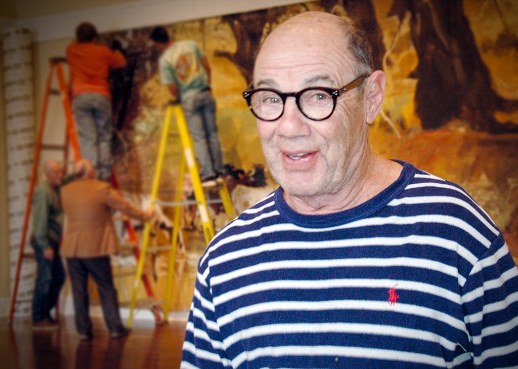 Mike Howard’s ‘Coming Home” exhibit features giant canvasses that tell the story of rural life in Alabama, Georgia and New York state. The exhibit was being installed Monday at the Johnson Center for the Arts in Troy. 