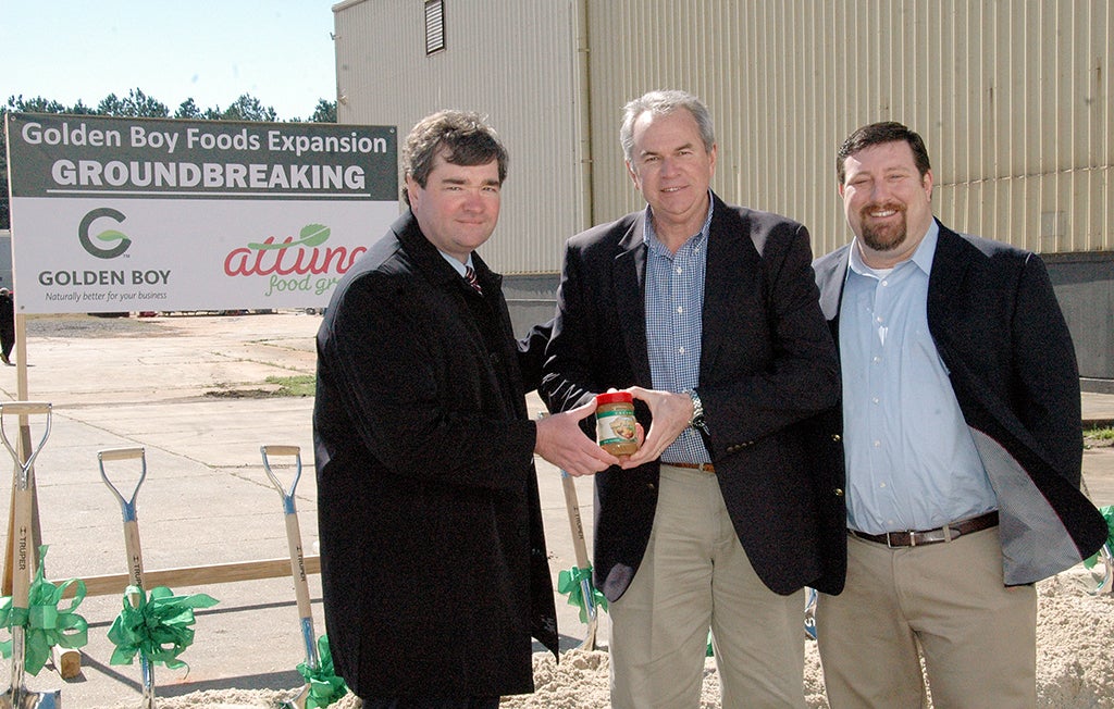 Golden Boy Foods in Troy broke ground for it 45,000-square-foot expansion project Tuesday. Troy Mayor Jason A. Reeves, left; Golden Boy Foods President, Jack Warden, center; and Golden Boy Foods/Troy Plant Manager Robert Jacobs, celebrated the expansion project. 
