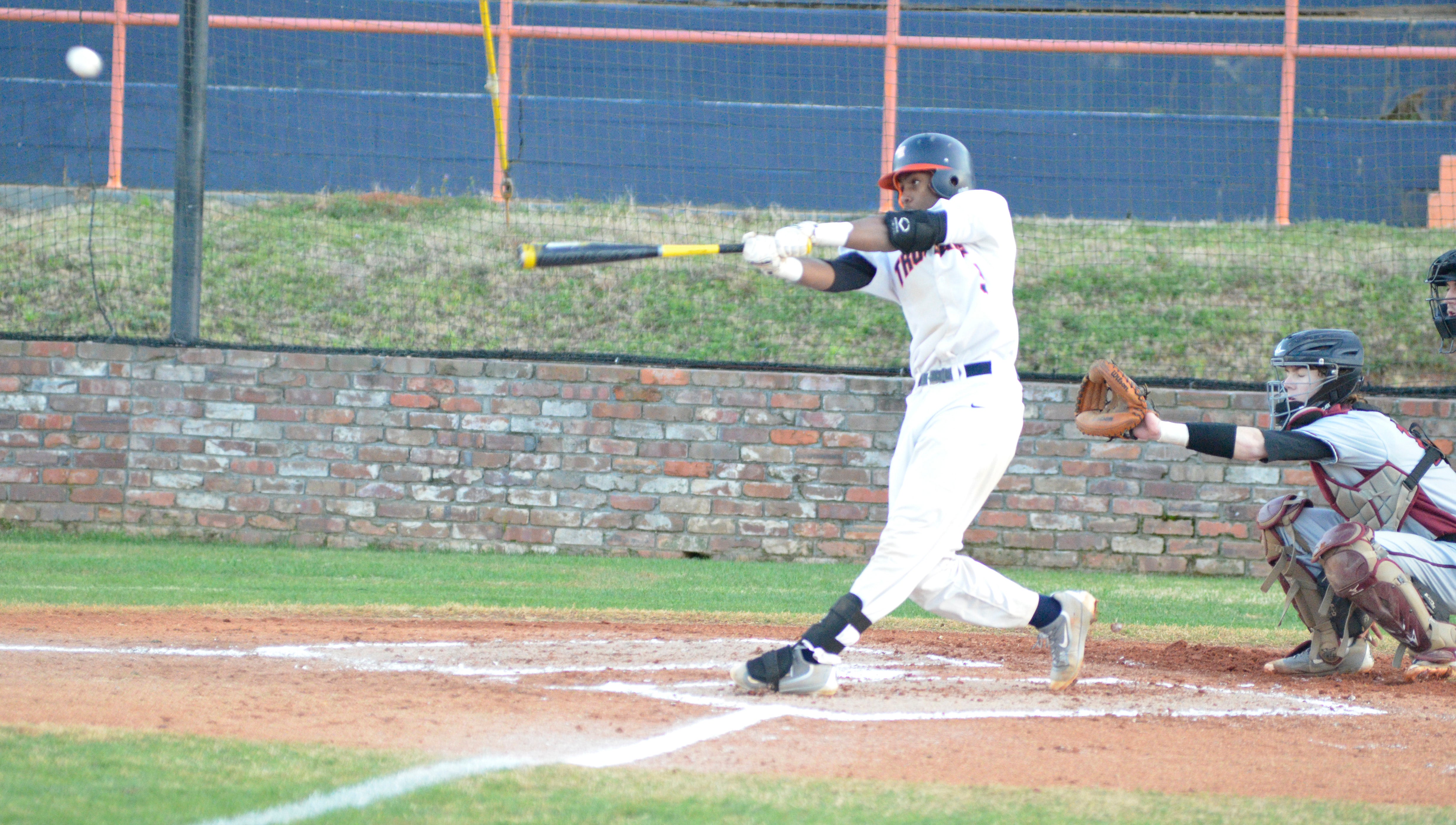  Nick Lews takes a swing during Charles Henderson’s game against Prattville on Thursday night. Nick Lewis and the Trojans defeated the Lions 5-3 in day one of the Terry Sikes Memorial Tournament. 