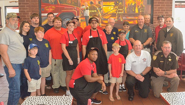 Firehouse Subs Public Safety Foundation celebrated $21,220 worth of life-saving equipment grants awarded to Spring Hill Volunteer Fire Department and Banks Community Volunteer Fire Department. David Conklin, Firehouse Subs Area representative; Rex Lewis, Troy Firehouse Subs franchisee; and Meghan Vargas, Firehouse Subs Public Safety Foundation senior manager of foundation development attended the celebration along with members of the volunteer fire departments and members of the local law enforcement agencies. Below, Banks VFD Chief Shayne Brown expressed appreciation to Firehouse Subs Public Safety Foundation for the grant funds that allow his department to purchase a skid until that can be used on large tracts of farmland or timberland. Jeff Helms, chief Spring Hill Volunteer Fire Department, demonstrated the thermal imaging camera that was purchased with grant funding from the Firehouse Subs Public Safety Foundation. 